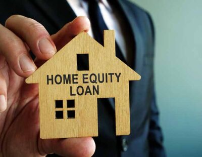 Home Equity Loan sign on a wooden model of house.